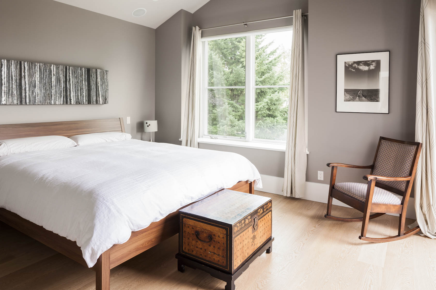 Clean and bright bedroom with modern design at the Cambie Corridor custom house.
