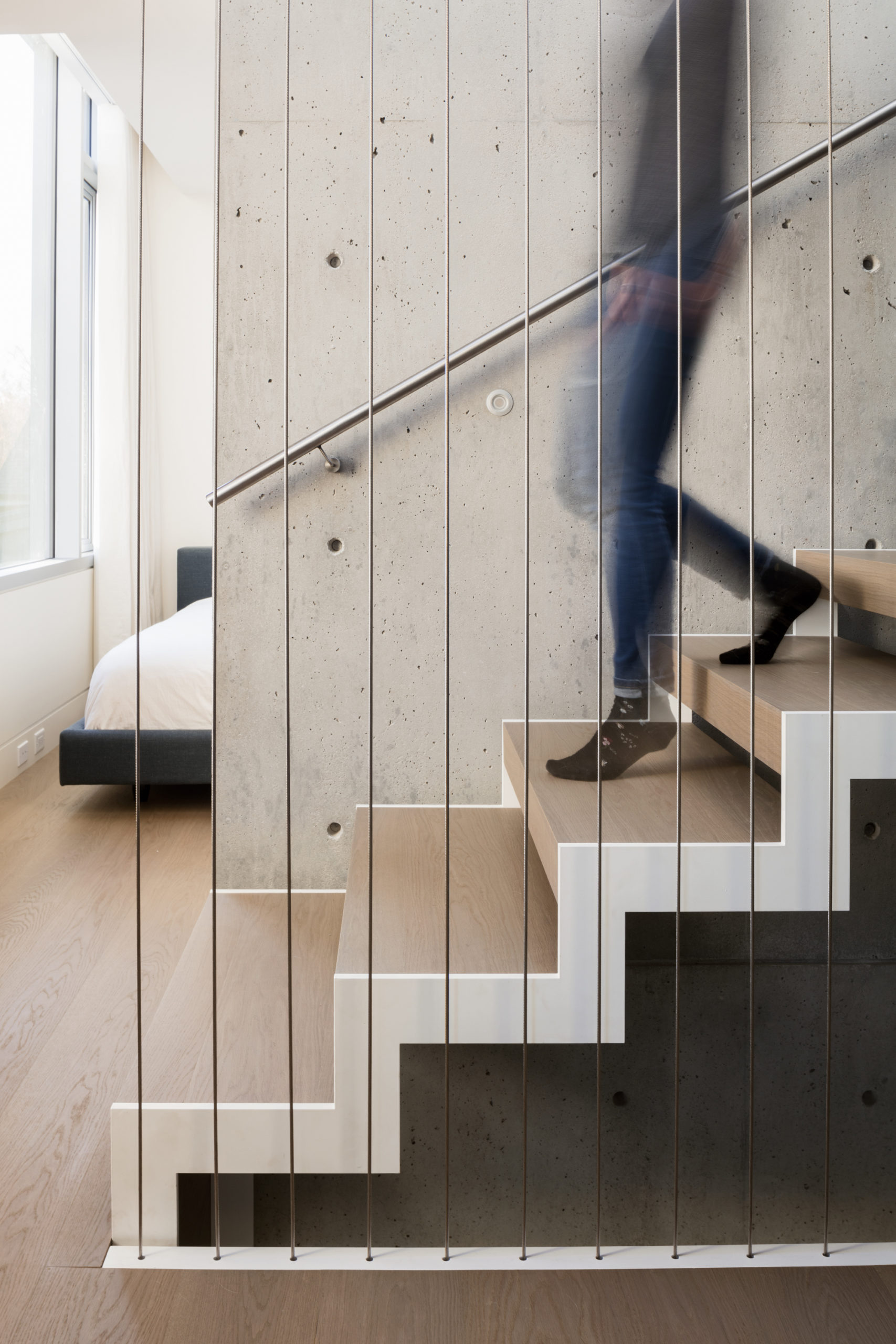 Contemporary stairs with a minimalist design at a custom home in Vancouver.