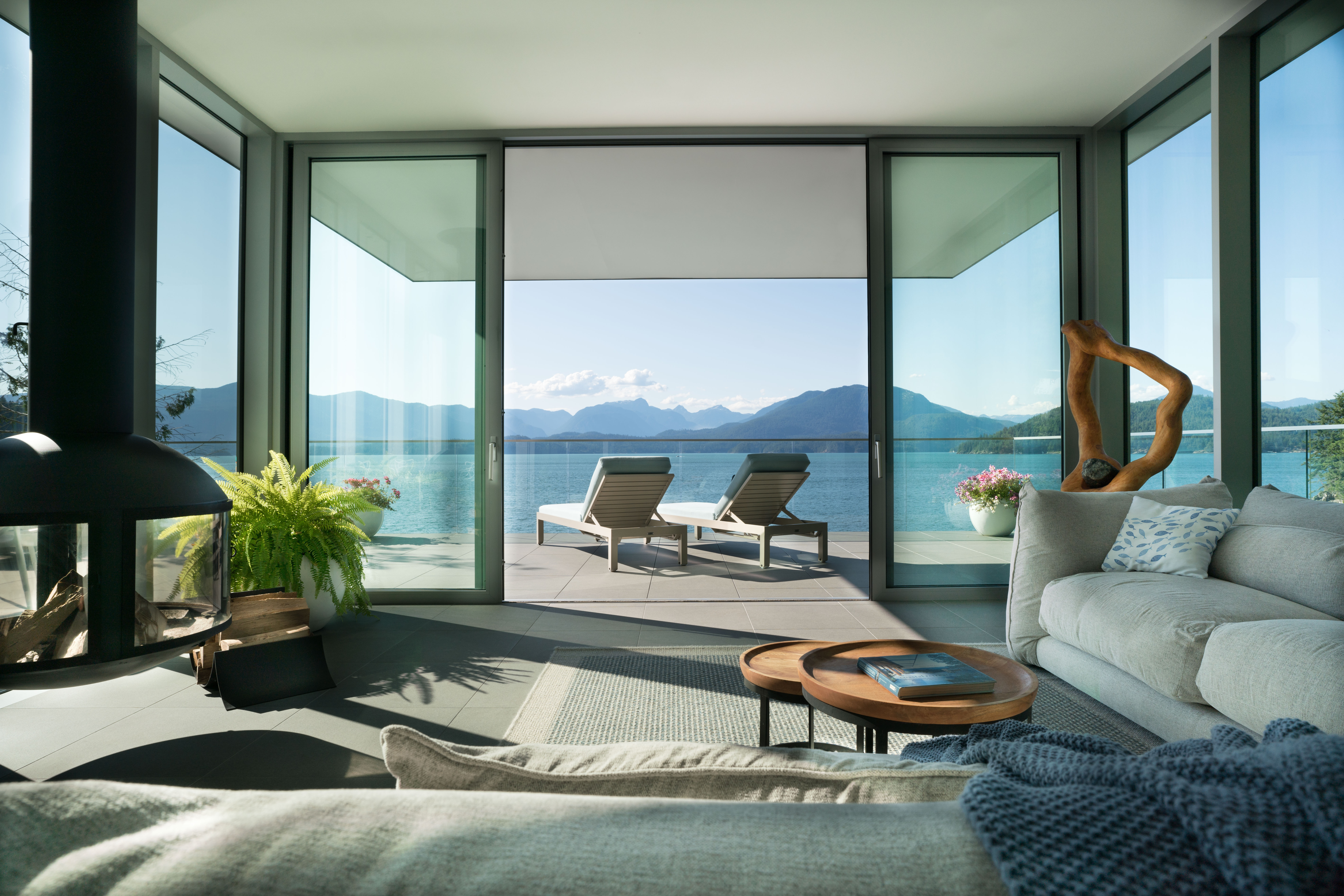 Contemporary living room design with ocean view in a luxurious custom residence on Bowen Island.